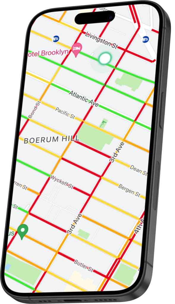 Phone showing a street map with parking availability coloured from green to red along the streets.